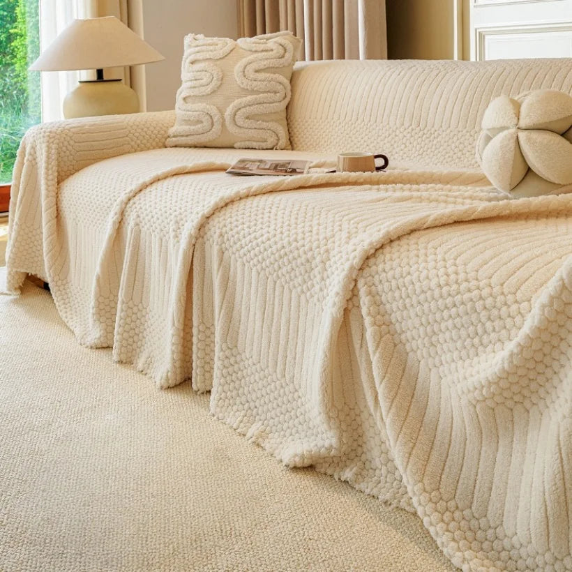 Manta jacquard boêmio Kazaen em cor caqui sobre poltrona
